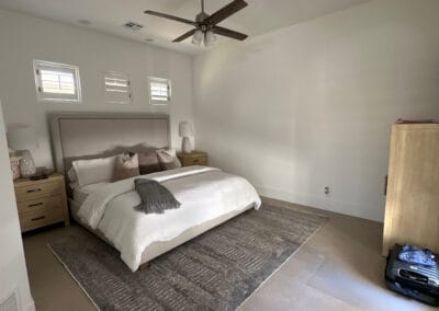 Home bedroom remodel featuring earthtone stone flooring