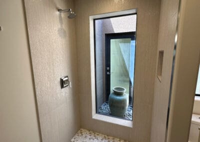 Image features an upgraded bathroom remodel with shower stone and design.