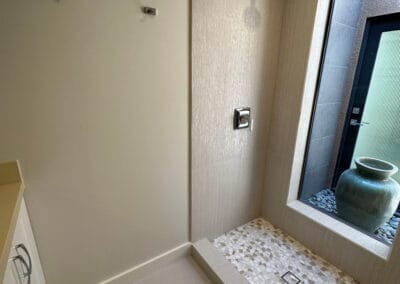 Image features an upgraded bathroom remodel with shower stone and design.