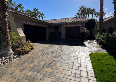 Image features an upgraded stone driveway.