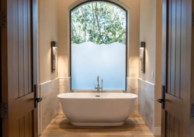 Modern bathroom design features and elegant and stunning bathtub with upgraded flooring and lighting throughout.