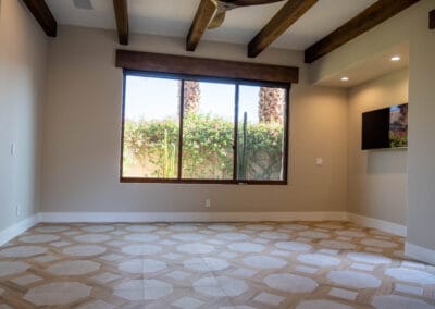 Custom home remodel featuring hexagonal stone and wood tile